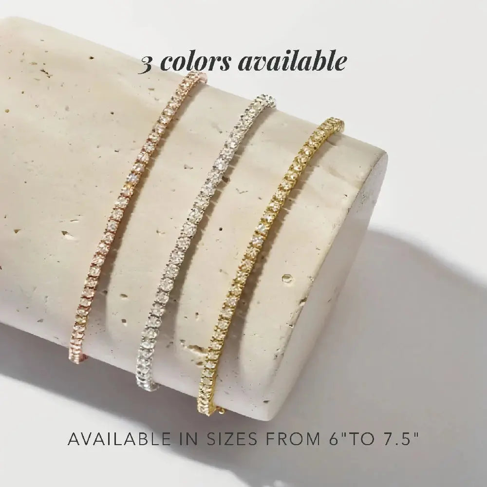 Three gold bracelets on a beige cylindrical object with text indicating color availability and size range.